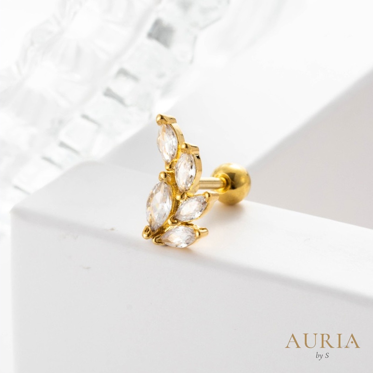 Piercing Pluma dorado con hojas de cristal